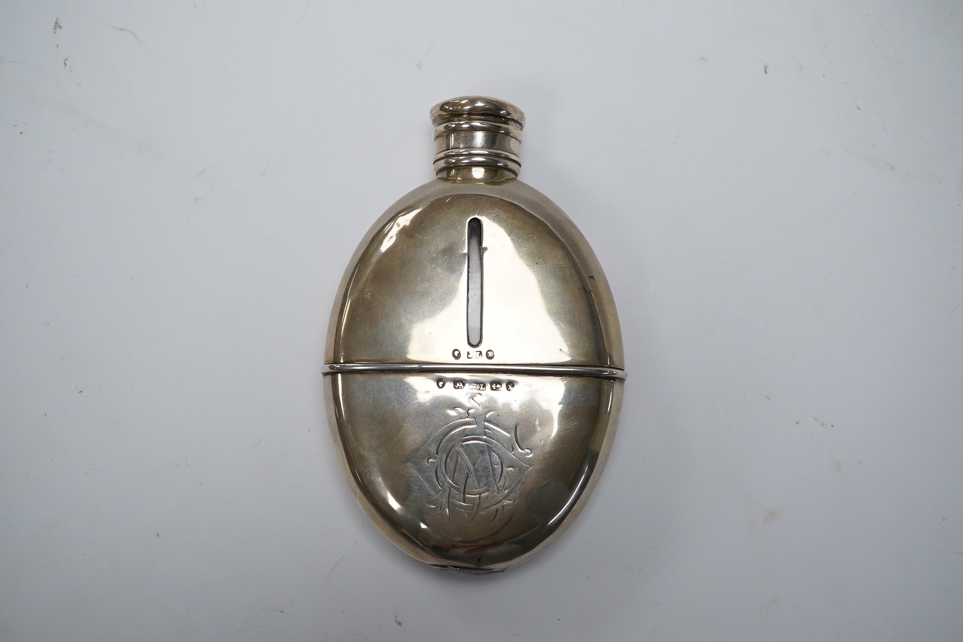 A Victorian silver oval pocket flask, John Linegar, Birmingham, 1872, 12.8cm. Condition - poor